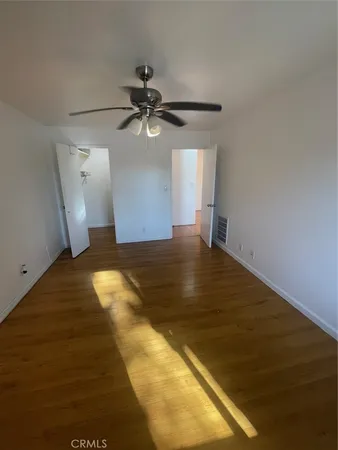 a view of a big room with wooden floor