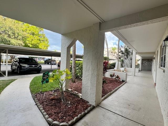 946 Virginia Street, Unit 104 Dunedin, FL 34698 - Photo 21 of 64 a view of a couches in patio of the house