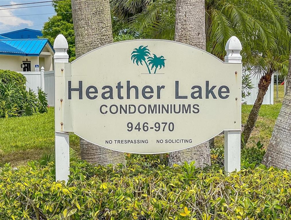 946 Virginia Street, Unit 104 Dunedin, FL 34698 - Photo 27 of 64 a sign on the side of the road