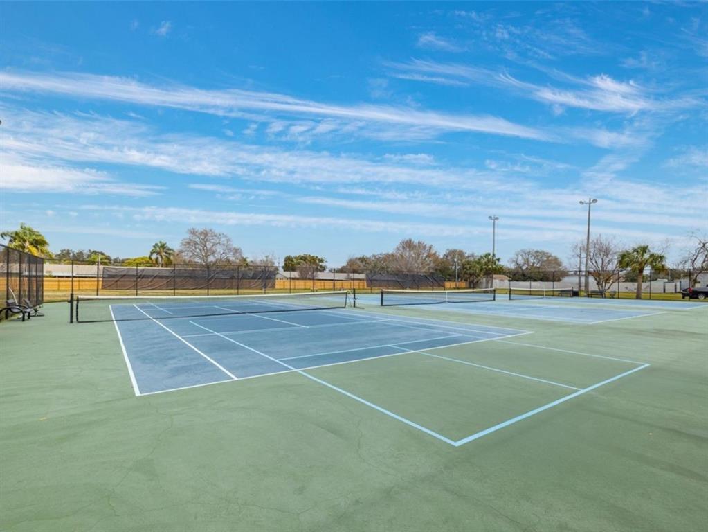 946 Virginia Street, Unit 104 Dunedin, FL 34698 - Photo 34 of 64 a view of an outdoor space and tennis court