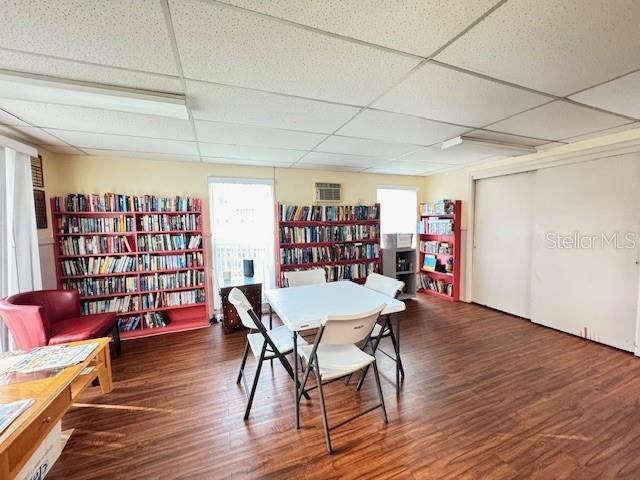 946 Virginia Street, Unit 104 Dunedin, FL 34698 - Photo 37 of 64 a view of a dining room with furniture and wooden floor