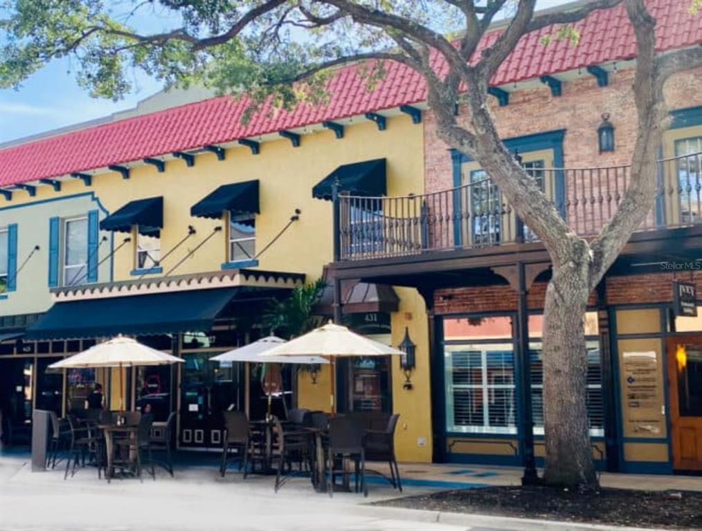 946 Virginia Street, Unit 104 Dunedin, FL 34698 - Photo 46 of 64 a view of a cafe with sitting area