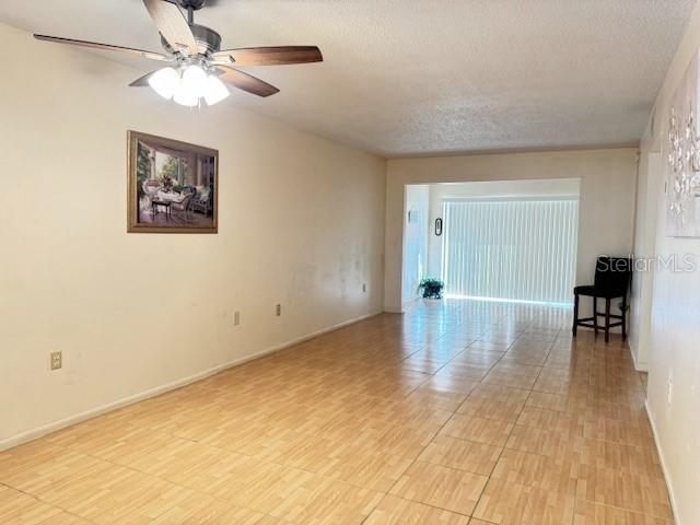 946 Virginia Street, Unit 104 Dunedin, FL 34698 - Photo 8 of 64 a view of empty room with wooden floor