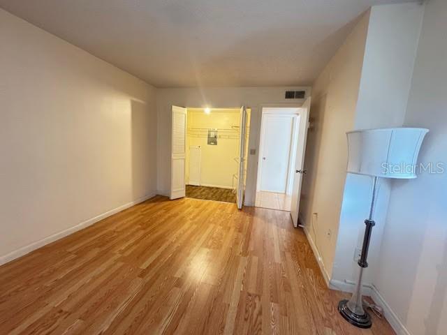 946 Virginia Street, Unit 104 Dunedin, FL 34698 - Photo 10 of 64 a view of a room with wooden floor and cabinets