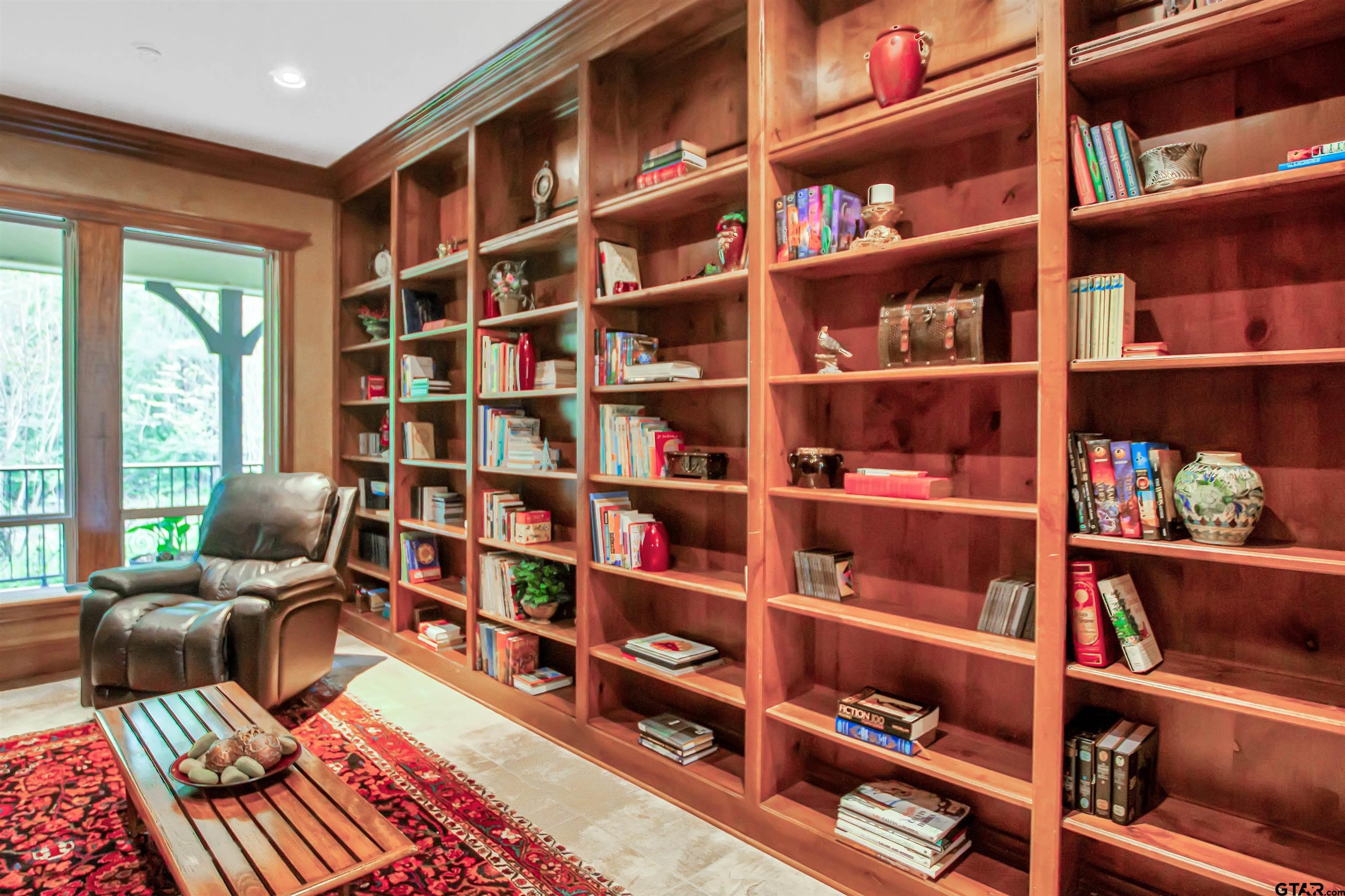 8350 Farm To Market 346 Flint, TX 75762 - Photo 19 of 47 a living room with furniture and a book shelf