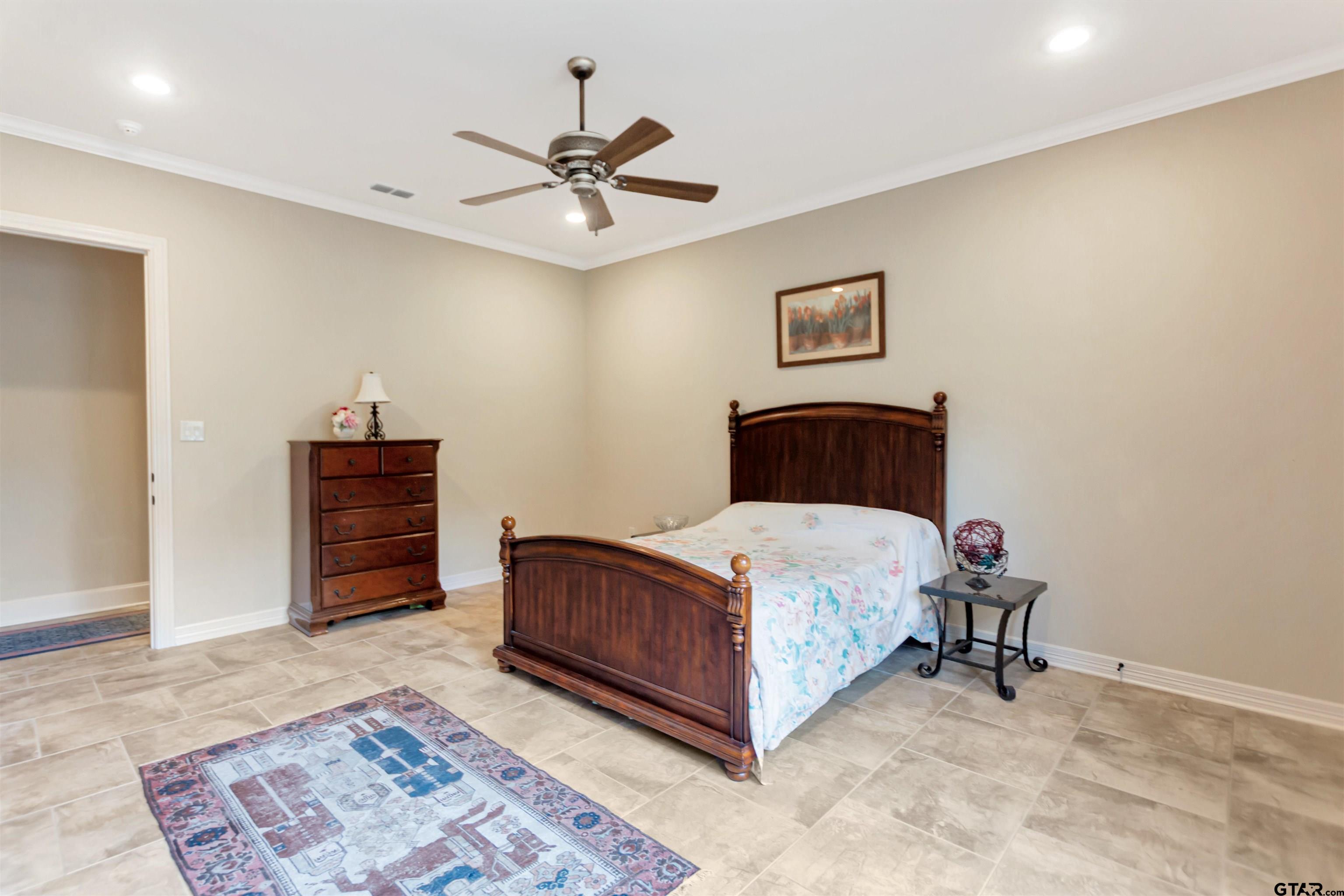 8350 Farm To Market 346 Flint, TX 75762 - Photo 25 of 47 a bedroom with a bed and a chandelier