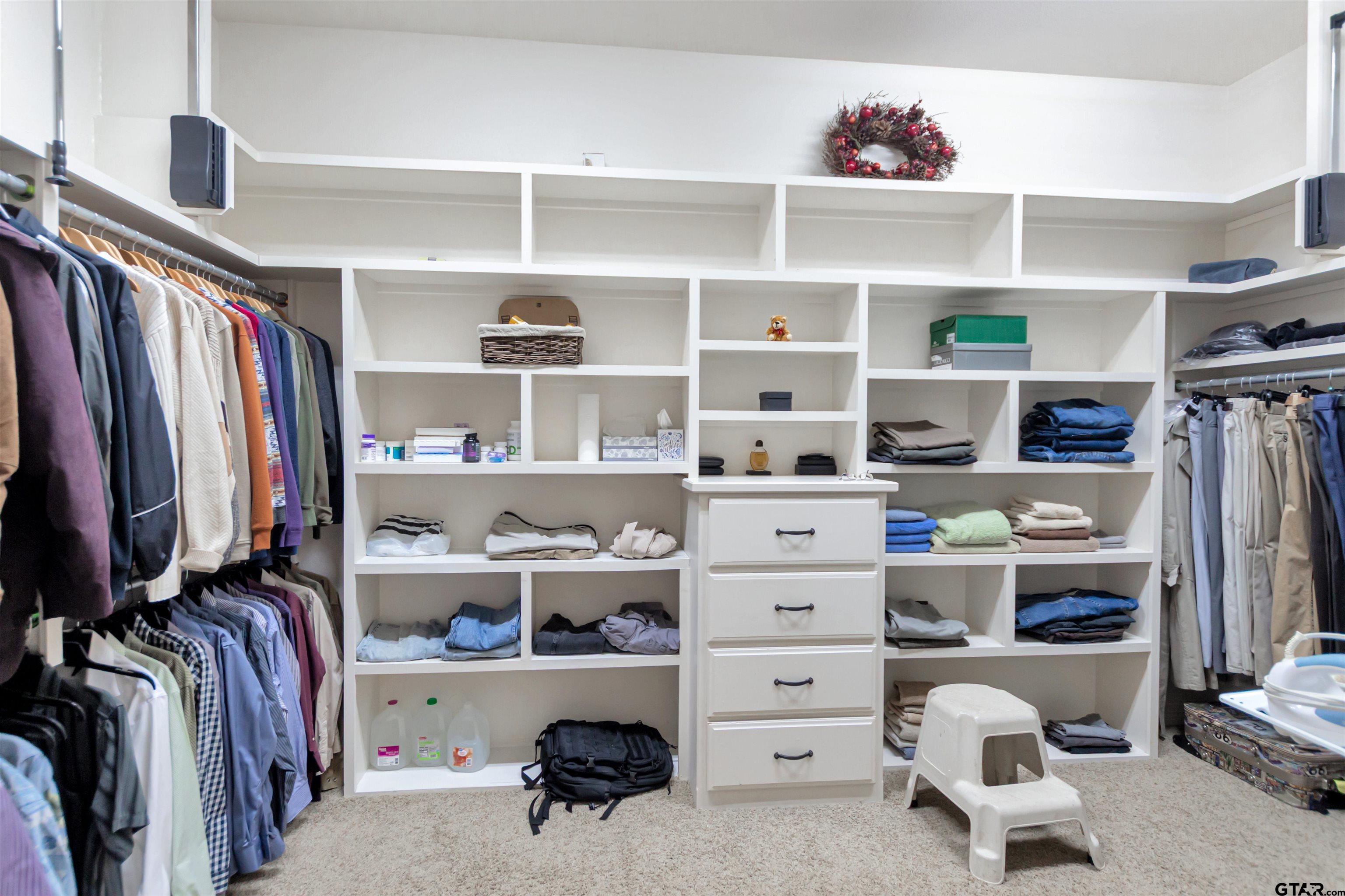 8350 Farm To Market 346 Flint, TX 75762 - Photo 34 of 47 a view of walk in closet with clothes and shoes