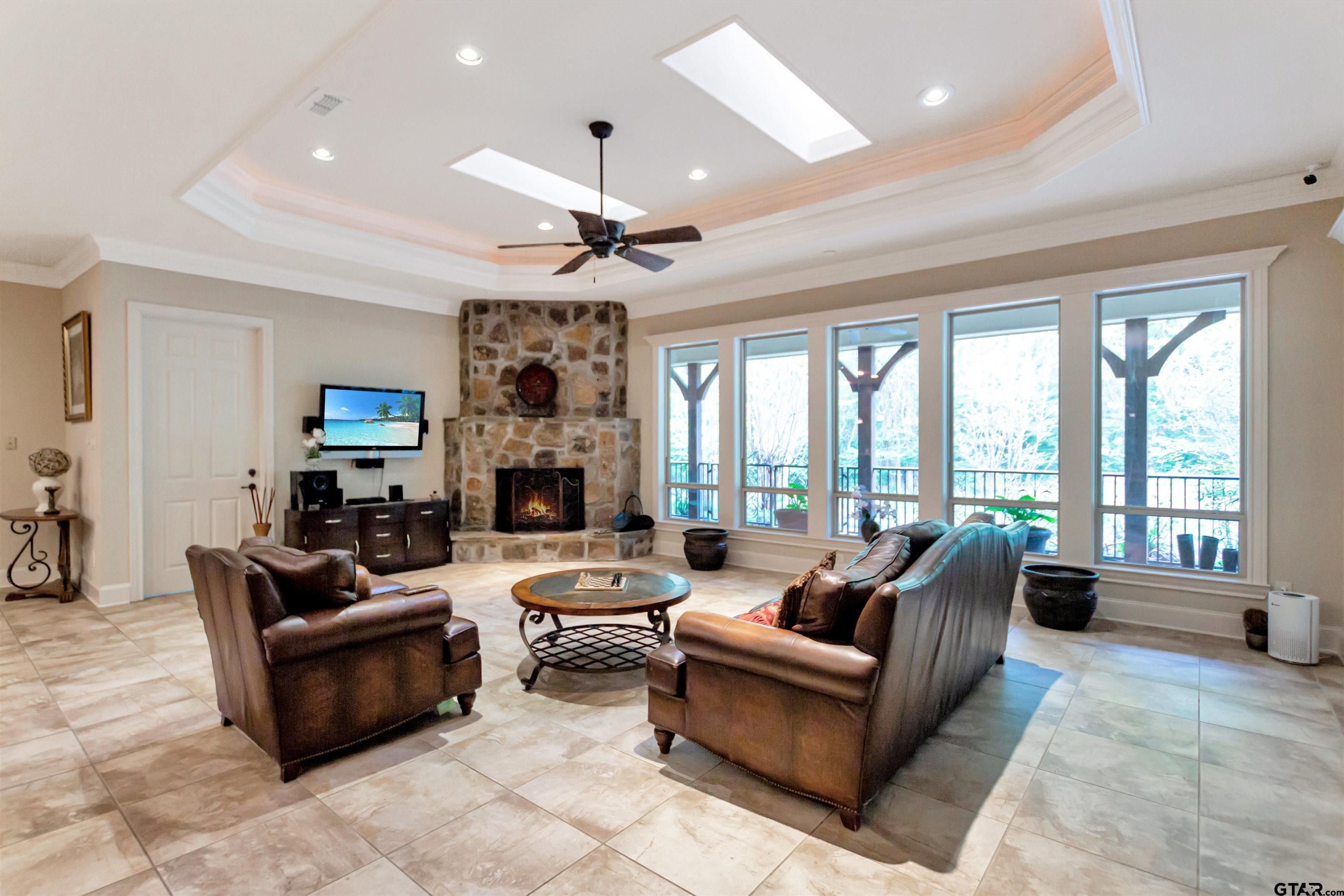 8350 Farm To Market 346 Flint, TX 75762 - Photo 5 of 47 a living room with furniture fireplace and large windows