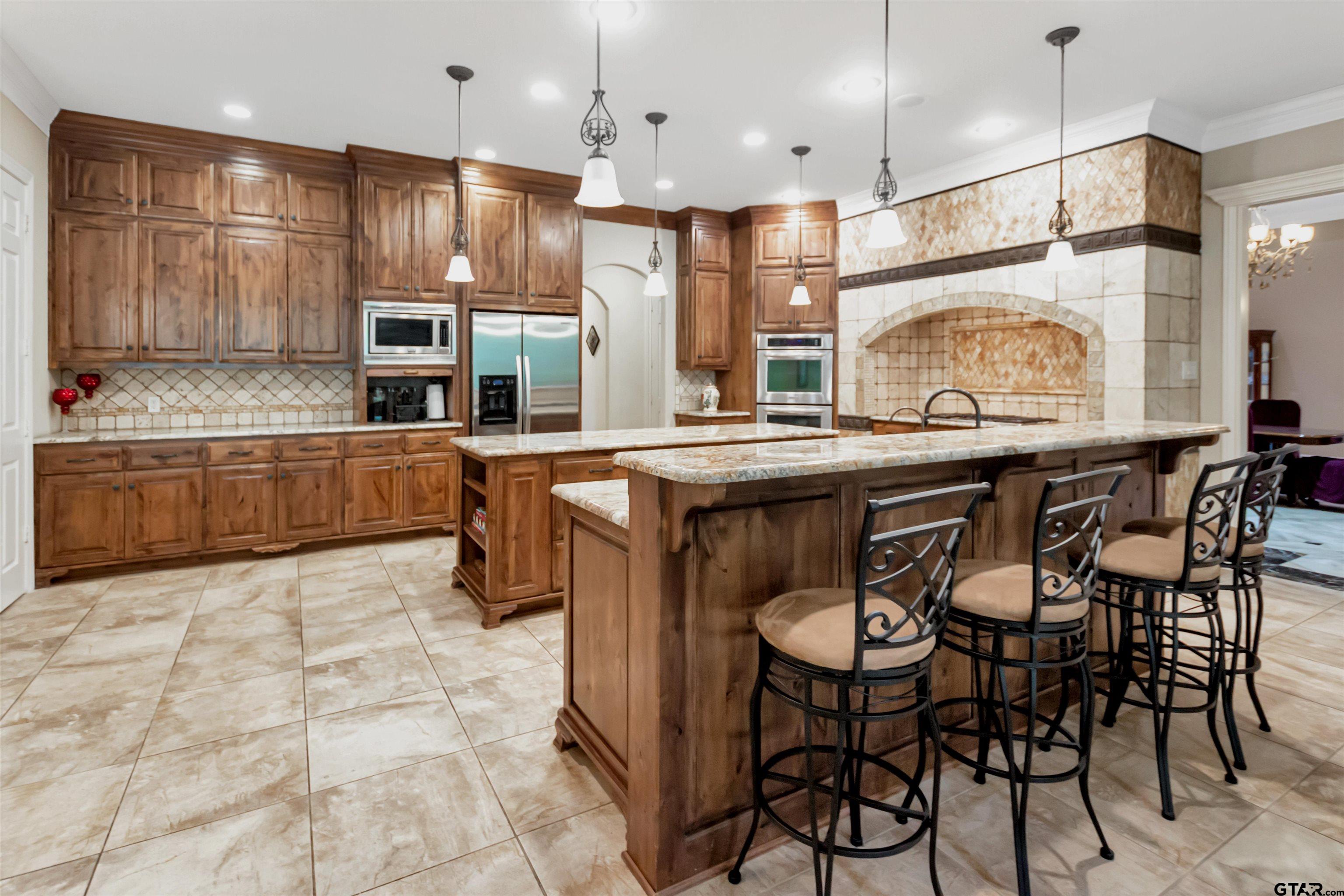 8350 Farm To Market 346 Flint, TX 75762 - Photo 6 of 47 a kitchen with stainless steel appliances granite countertop a sink and a refrigerator