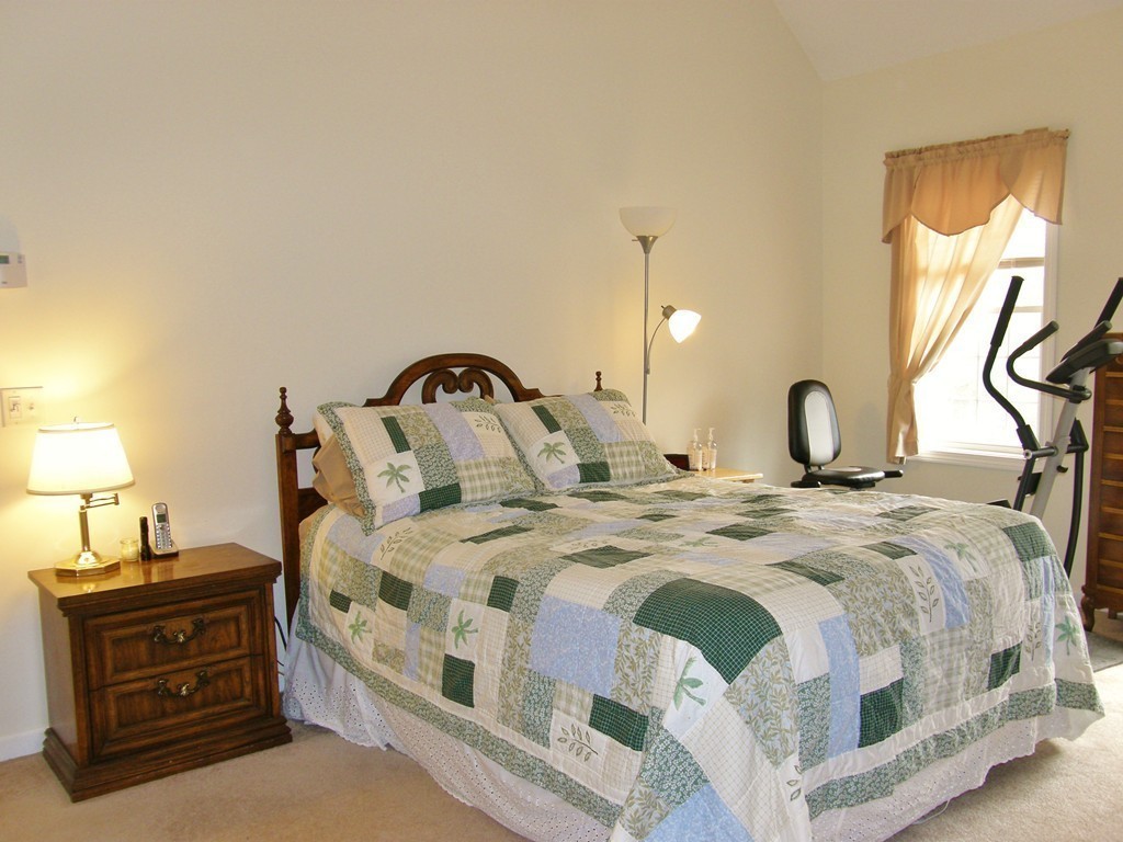 12 Tannery Road Sturbridge, MA 01518 - Photo 15 of 26 a bedroom with a bed and a lamp on dresser