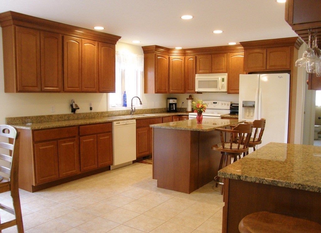 12 Tannery Road Sturbridge, MA 01518 - Photo 2 of 26 a kitchen with stainless steel appliances granite countertop wooden cabinets a sink and dishwasher