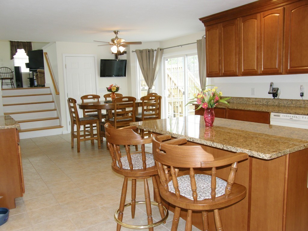 12 Tannery Road Sturbridge, MA 01518 - Photo 6 of 26 a kitchen with a table and chairs in it