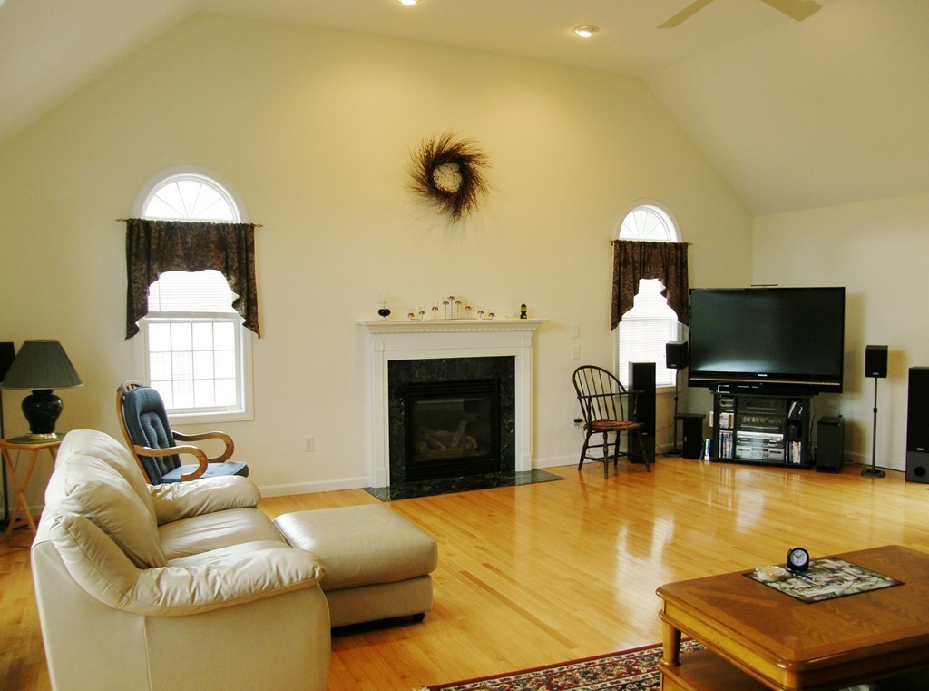 12 Tannery Road Sturbridge, MA 01518 - Photo 10 of 26 a living room with furniture and a fireplace