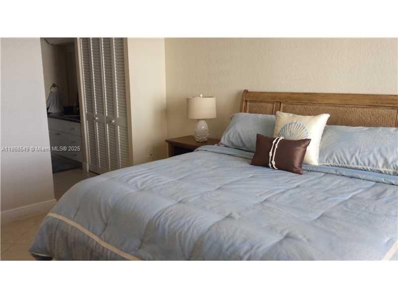 5701 Collins Avenue, Unit 405 Miami Beach, FL 33140 - Photo 9 of 18 a black and white photo of a room