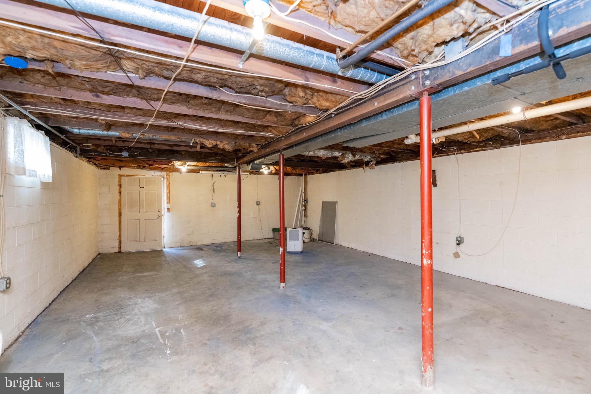 7822 Renshaw Road Pasadena, MD 21122 - Photo 27 of 33 Full unfinished basement with rear access