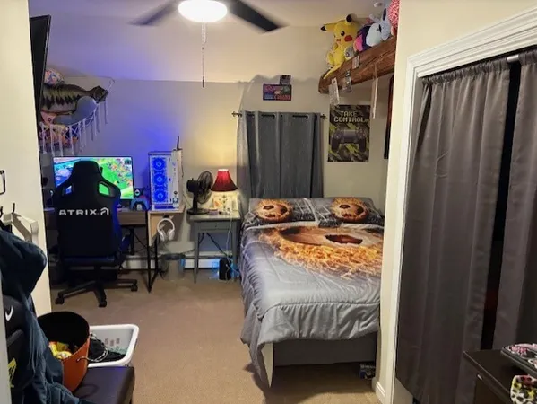 a bed room with a bed and a window