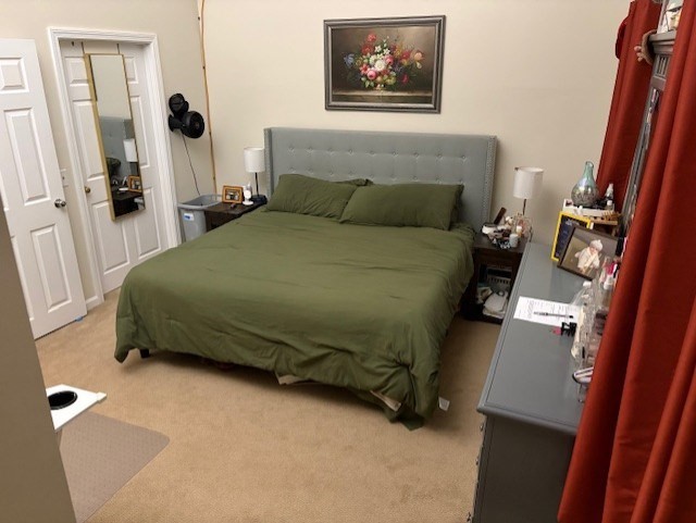 95 Providence Street, Unit B Mendon, MA 01756 - Photo 16 of 17 a bedroom with a bed and a mirror