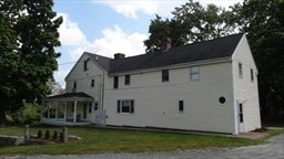 95 Providence Street, Unit B Mendon, MA 01756 - Photo 10 of 17 a view of front of house with a yard