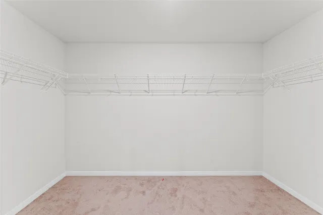 a view of a hallway with closet