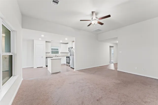 a kitchen with granite countertop sink stainless steel appliances and cabinets