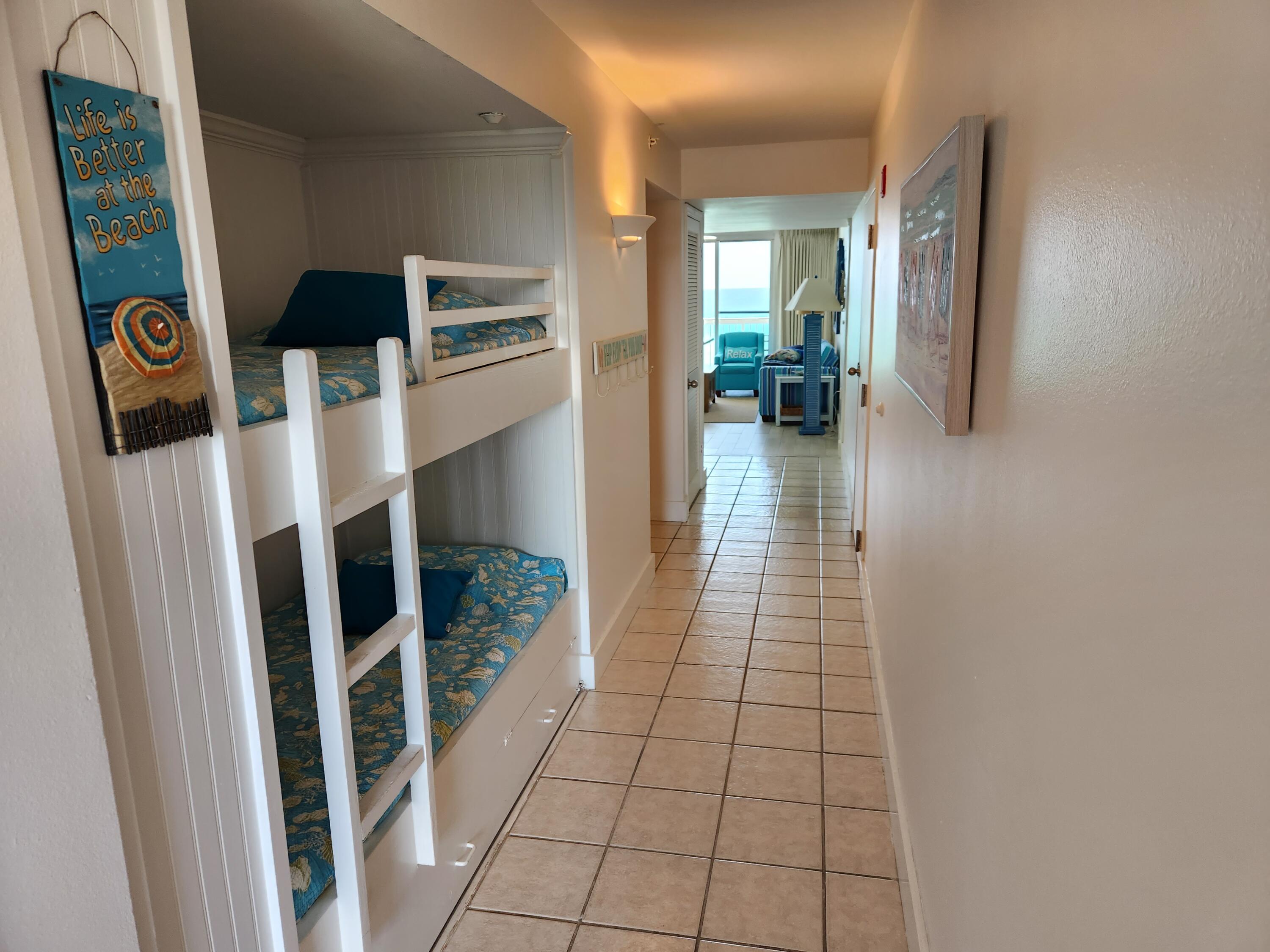 1002 Highway 98, Unit 505 Destin, FL 32541 - Photo 12 of 17 a hallway view with staircase