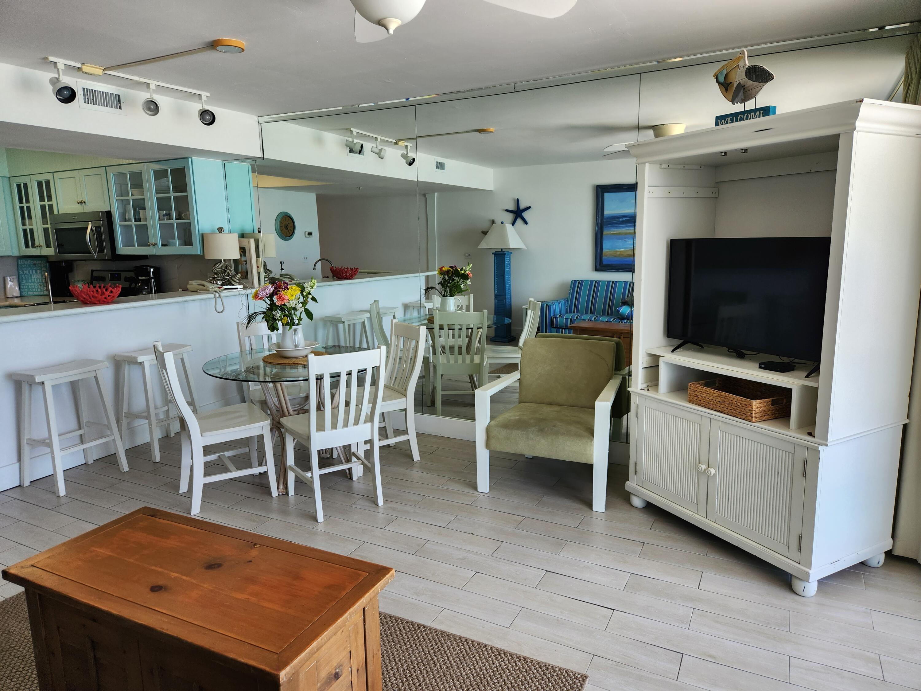 1002 Highway 98, Unit 505 Destin, FL 32541 - Photo 16 of 17 a view of a livingroom with furniture and a flat screen tv