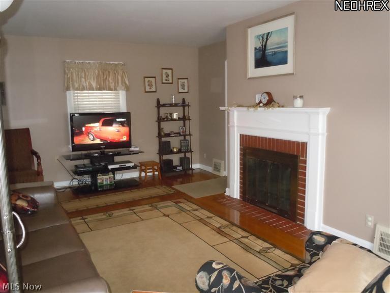 6606 Brecksville Road Independence, OH 44131 - Photo 4 of 11 Another view of living room with wood burning fireplace
