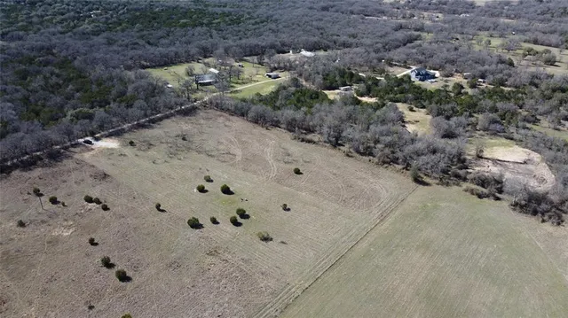 a view of a dry yard with wooden floor