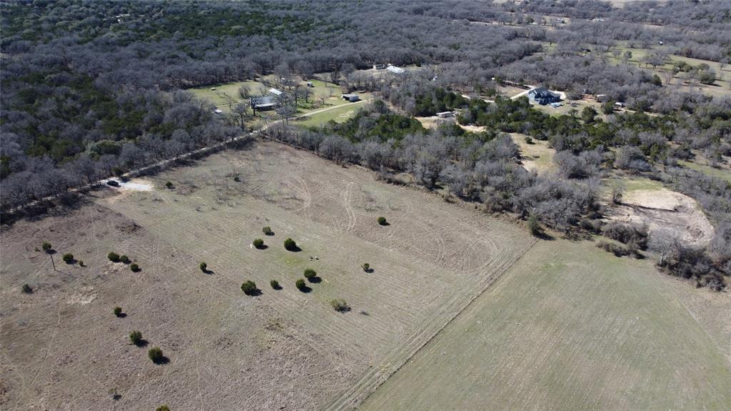 214 Private Road 2950 Kopperl, TX 76652 - Photo 3 of 9 a view of a dry yard with wooden floor