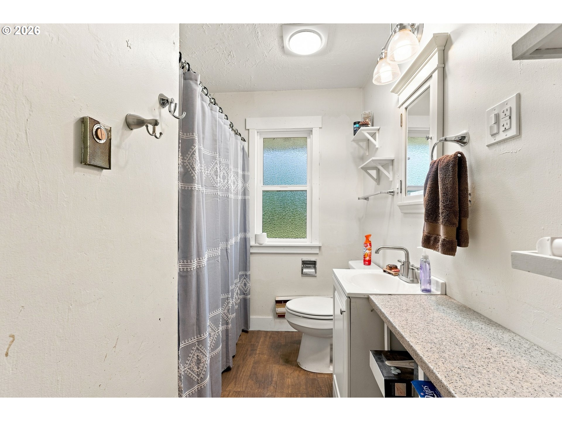 68763 Wasser Road Rainier, OR 97048 - Photo 13 of 42 a bathroom with a granite countertop sink mirror vanity and toilet