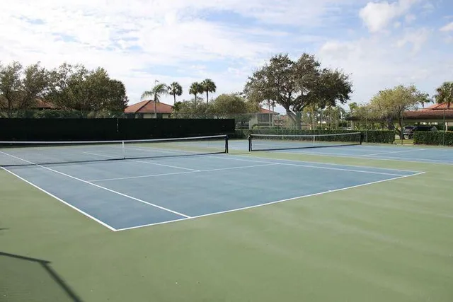 a view of an outdoor space and tennis court