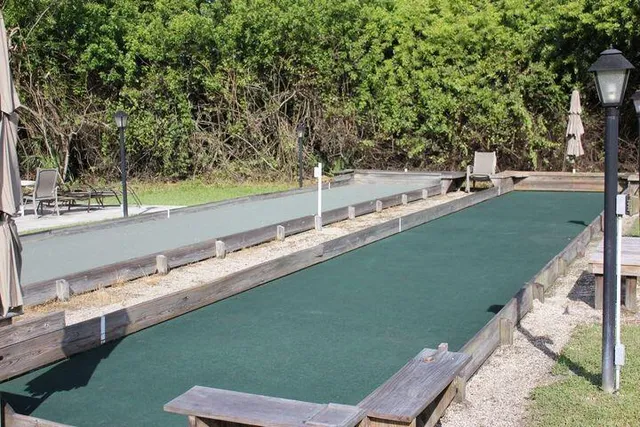 a view of outdoor space with green field and trees
