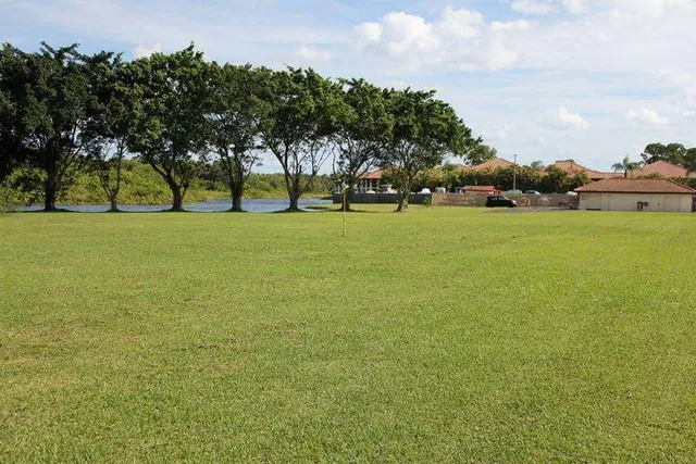 a view of a backyard with sitting area