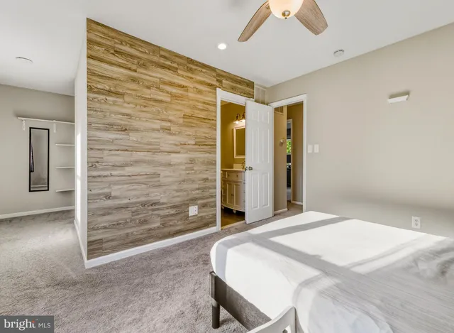 a bedroom with a bed and a walk in closet