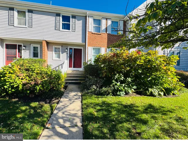 a view of a pathway both side of house