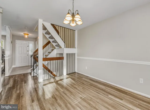 a view of entryway with wooden floor