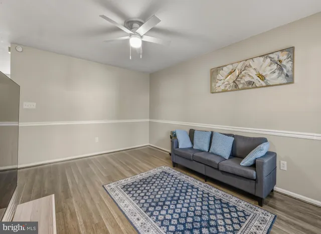 a living room with furniture and a rug