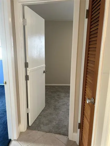 a bathroom with a granite countertop bathtub shower sink vanity and toilet