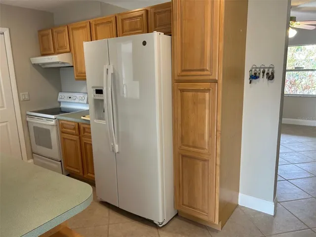 a view of an empty room and a window