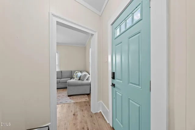 a living room with furniture kitchen view and a dining table