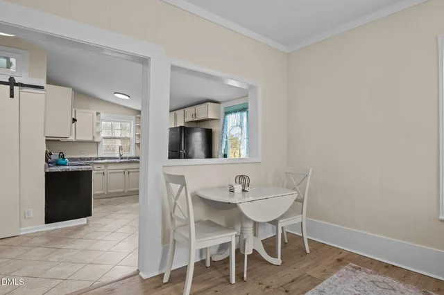 a view of a kitchen with a refrigerator and a stove