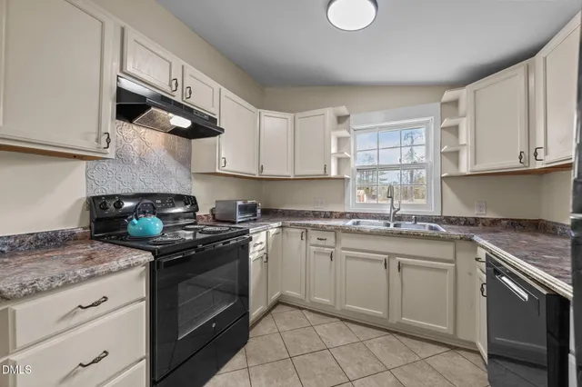 a kitchen with a stove and a microwave