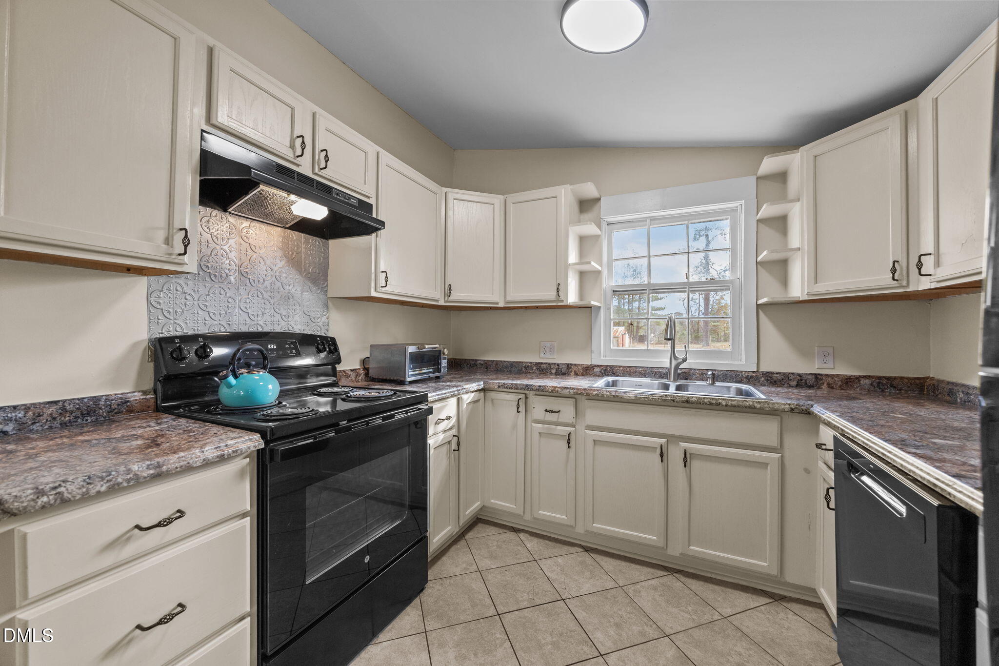 4325 Auburn Knightdale Road Raleigh, NC 27610 - Photo 25 of 34 a kitchen with granite countertop white cabinets stainless steel appliances and a sink