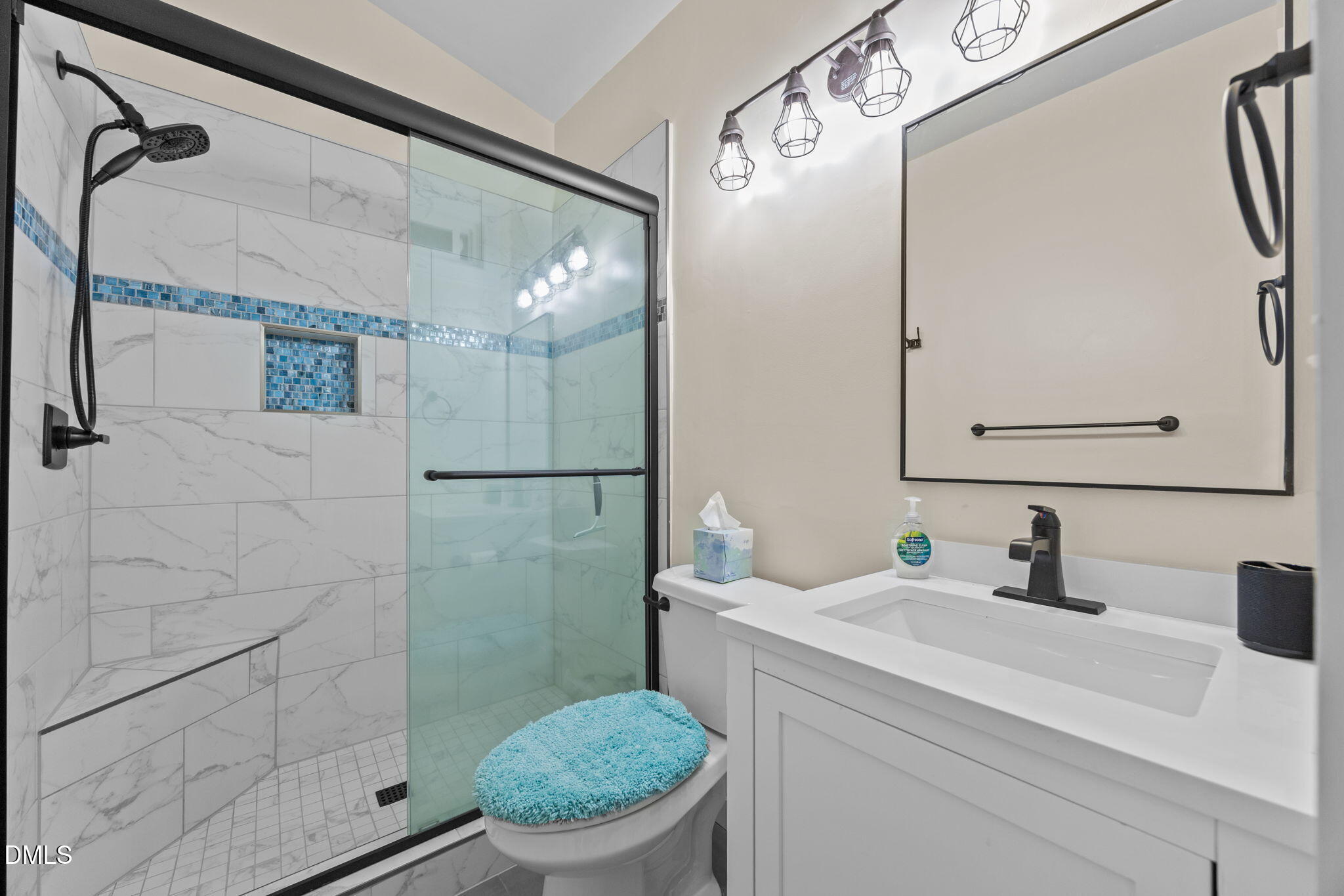 4325 Auburn Knightdale Road Raleigh, NC 27610 - Photo 33 of 34 a bathroom with a sink a toilet and shower