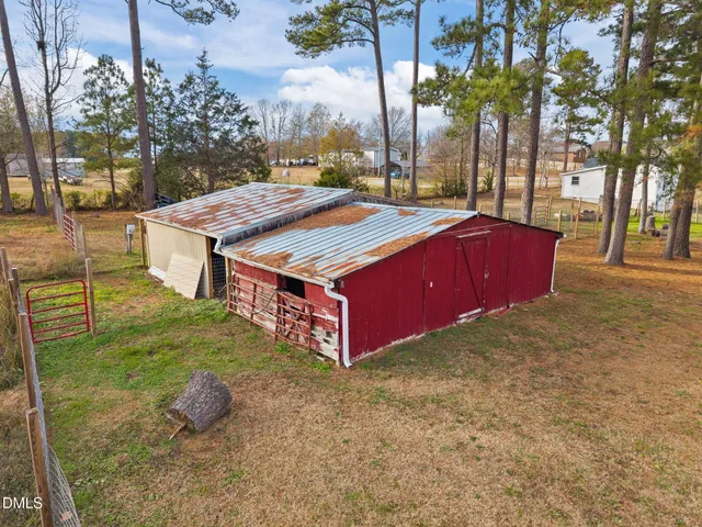 a view of a backyard with a tree