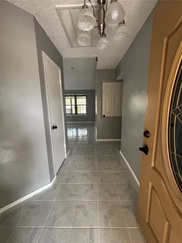 a bathroom with a glass shower door and a sink