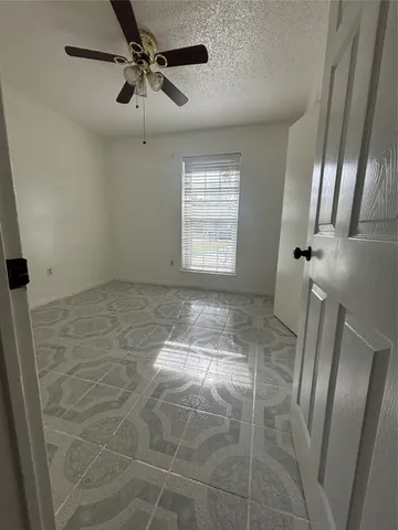 a view of empty room with a window