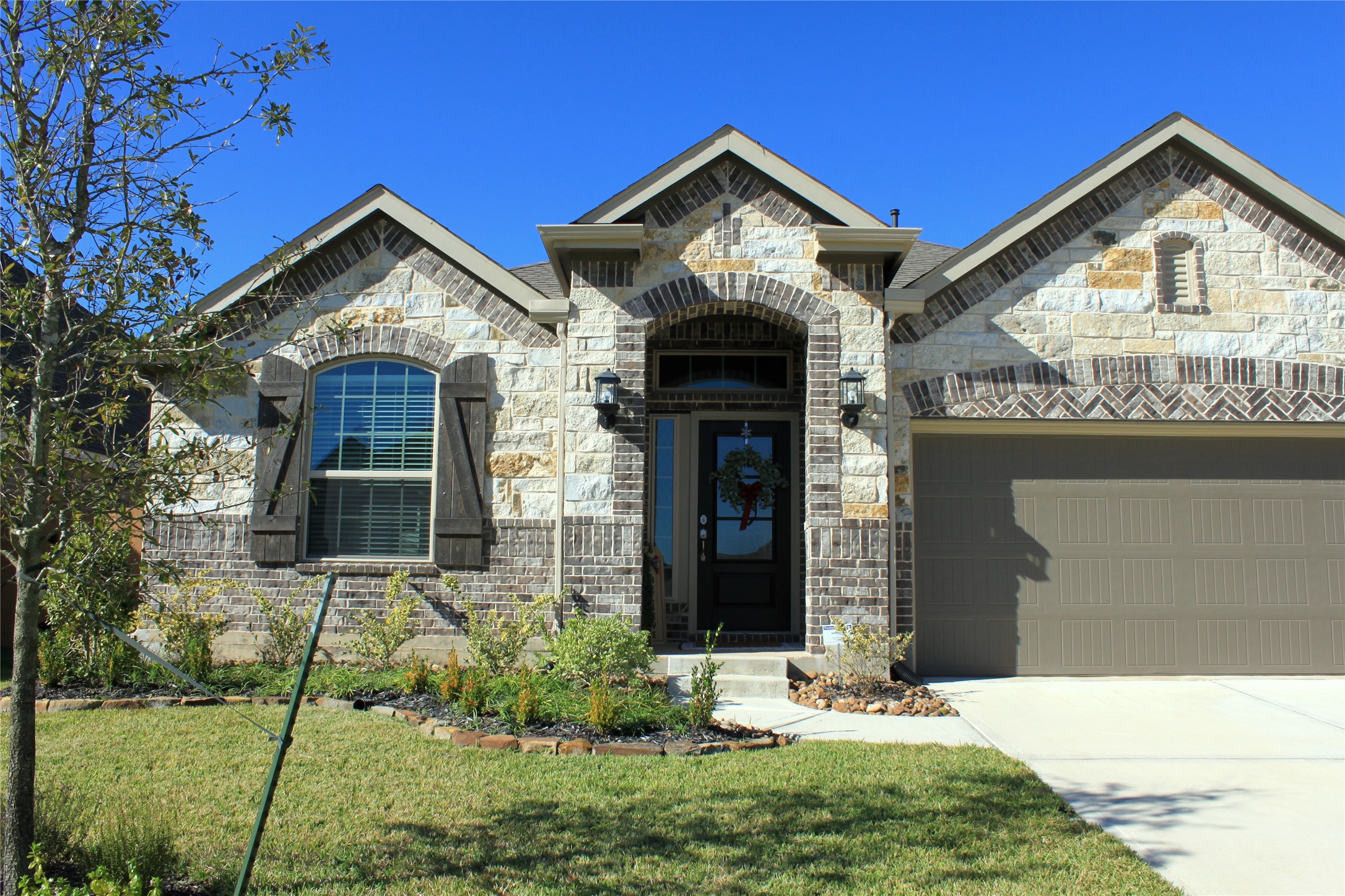 4408 Mimic Drive Spring, TX 77386 - Photo 26 of 27 a front view of a house with garden