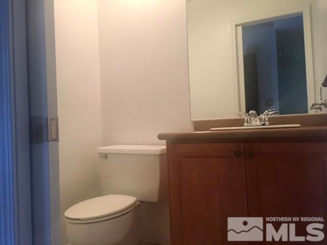 1937 South Villa Way Reno, NV 89509 - Photo 17 of 21 a bathroom with a sink a toilet and mirror