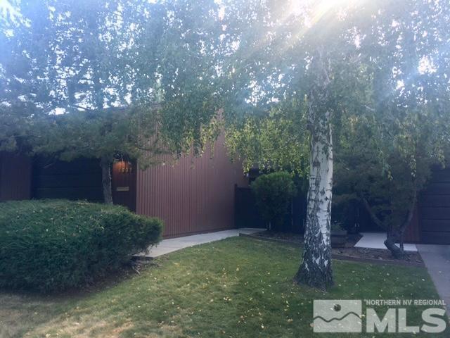 1937 South Villa Way Reno, NV 89509 - Photo 3 of 21 a backyard of a house with lots of green space and fountain